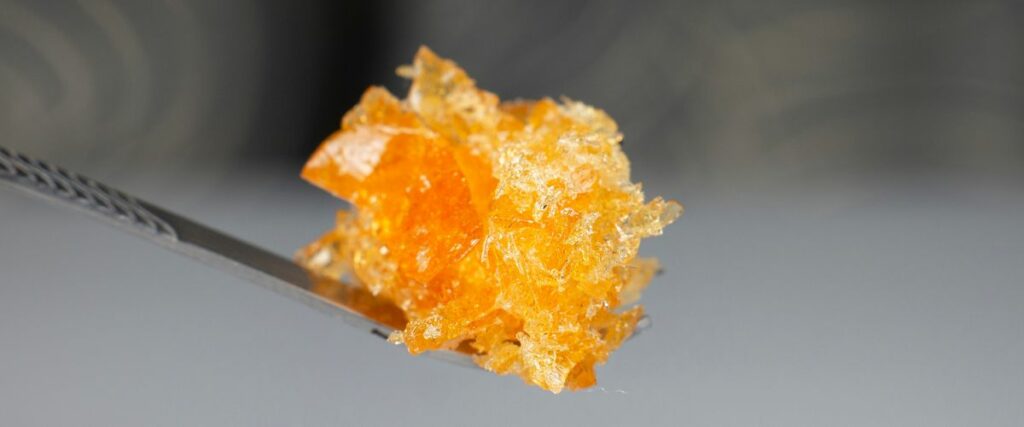 Close-up of a dab tool holding cannabis concentrate