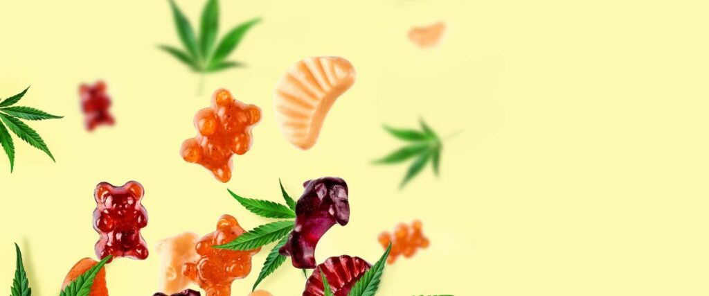 Various THC gummies floating alongside cannabis leaves on a light yellow background.