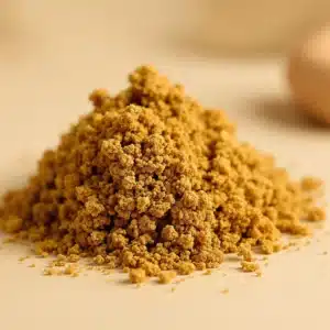 A close-up of THCA classic hash with a rich, amber-brown color and slightly textured surface, placed on a clean, neutral background. The focus is on the purity and dense concentration of the hash, capturing the subtle details and smooth edges that emphasize its quality.