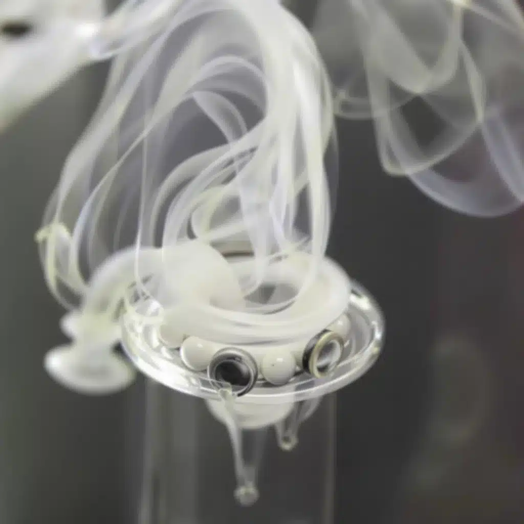 Spinner carb cap and terp pearls in action for efficient and flavorful dabbing.