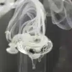 Spinner carb cap and terp pearls in action for efficient and flavorful dabbing.