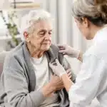 Elderly patient using cannabis for dementia treatment with caregiver support.