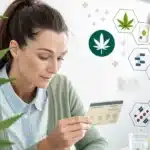 Focused woman holding a medical cannabis card, surrounded by digital icons depicting cannabis and healthcare, with a cannabis plant in the foreground