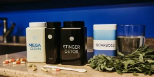 Detox drinks and capsules for THC removal displayed on a kitchen counter