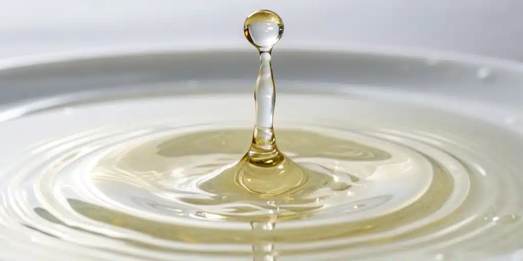 Pure CBD Distillate drop on a white background.