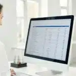 Person reviewing cannabis test results on a computer with clear detection time data.