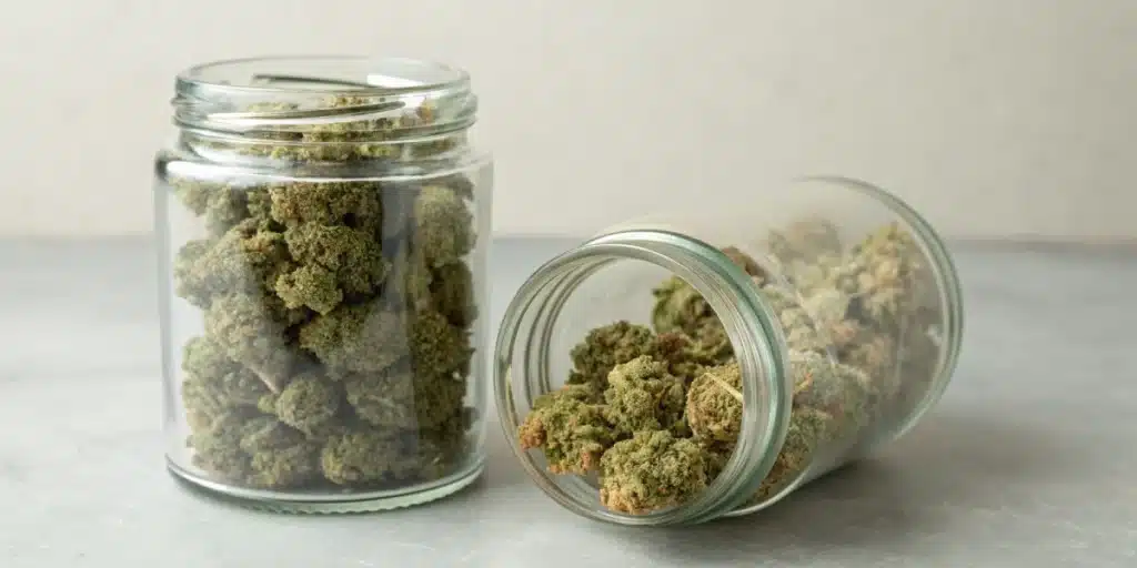 Realistic image comparing moldy weed in jar to properly stored cannabis, emphasizing effective storage solutions and prevention techniques.