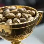 Golden trophy filled with high-quality cannabis seeds, representing the best cannabis strains of 2024.