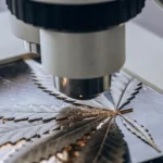 Close-up, hyper-detailed view of a cannabis leaf under the lens of a microscope, for scientific analysis.